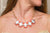 Collar corto eslabones dorados con 5 rectangulos melon y lila