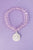 Pulsera cristales rosa pastel con dije de San Benito plateado
