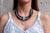 Collar tipo piel negra trenzada con plateado