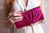 Clutch Rosa Fucsia en tela drapeada con broche plateado