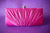 Clutch Rosa Fucsia en tela drapeada con broche plateado