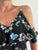 Jumpsuit Negro con flores azules, blancas y rosa pastel