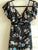 Jumpsuit Negro con flores azules, blancas y rosa pastel